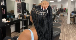 Medium knotless braids with even parts, done at Kekem African Braids in Spring, TX